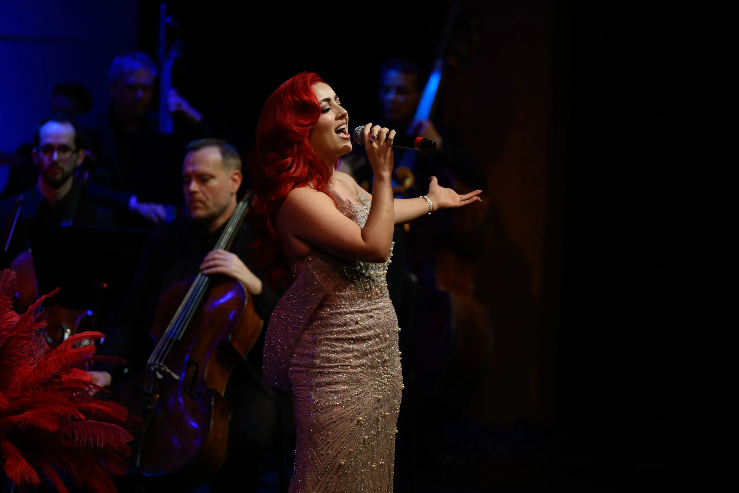 IMG_7120 Monique Abbadie performing as the orchestra plays around her.