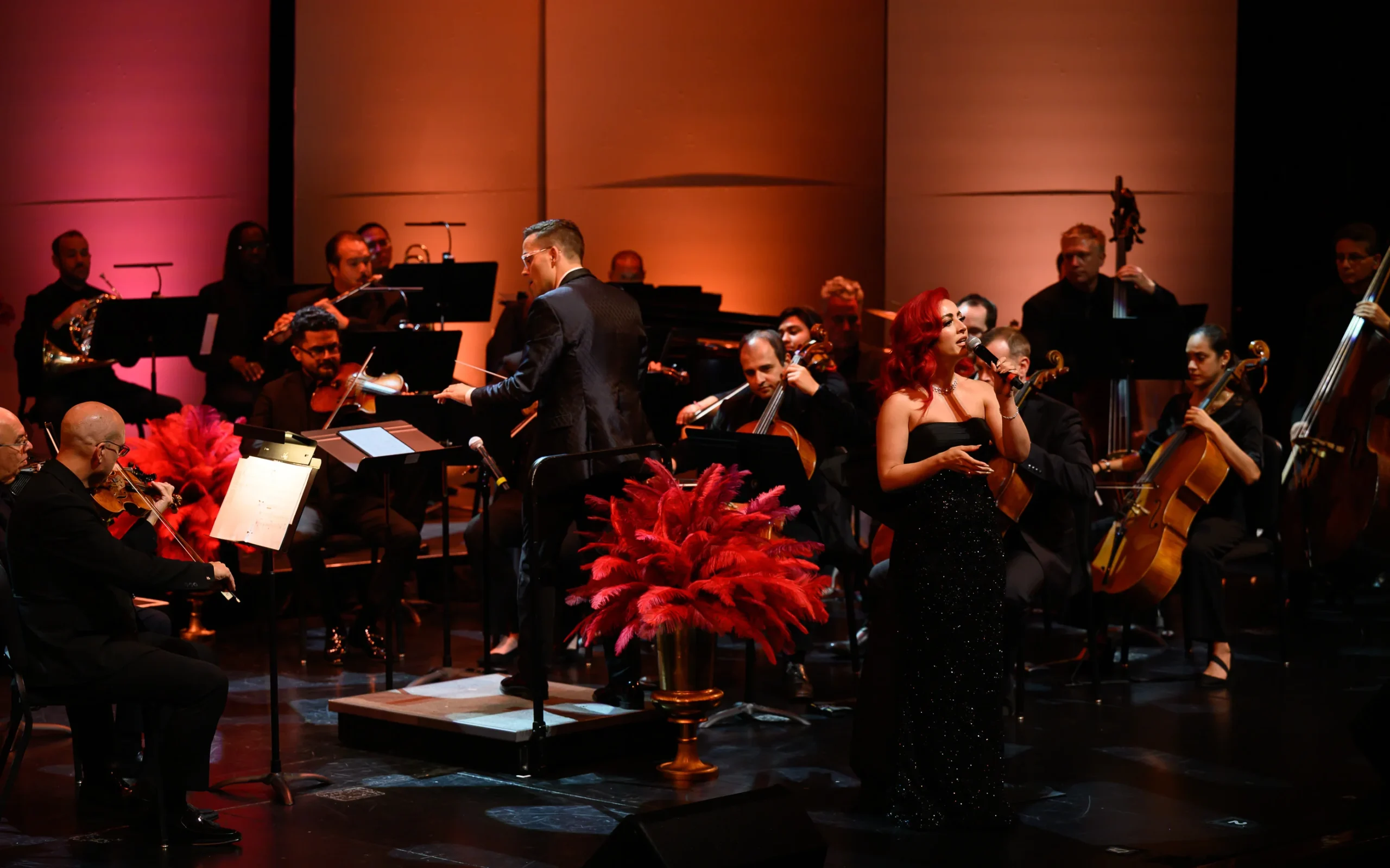 Monique Abbadie in performance, surrounded by the orchestra.