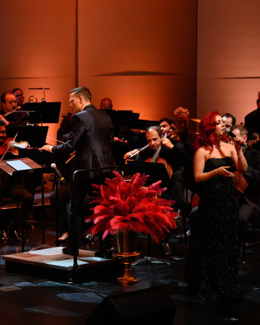 Monique Abbadie in performance, surrounded by the orchestra.