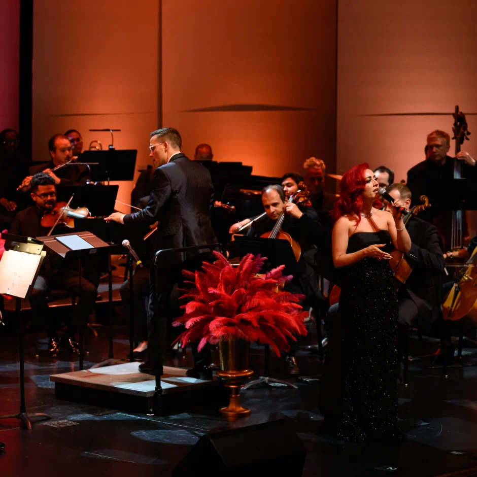 Monique Abbadie in performance, surrounded by the orchestra.