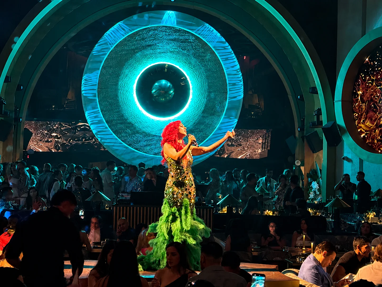 Monique Abbadie performing at a chic and lavish event.