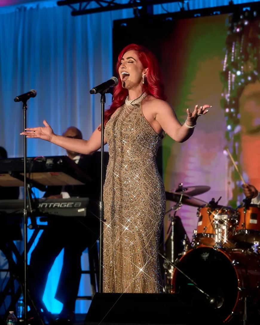 Monique Abbadie performing on stage at the Whitney E. Houston Foundation gala